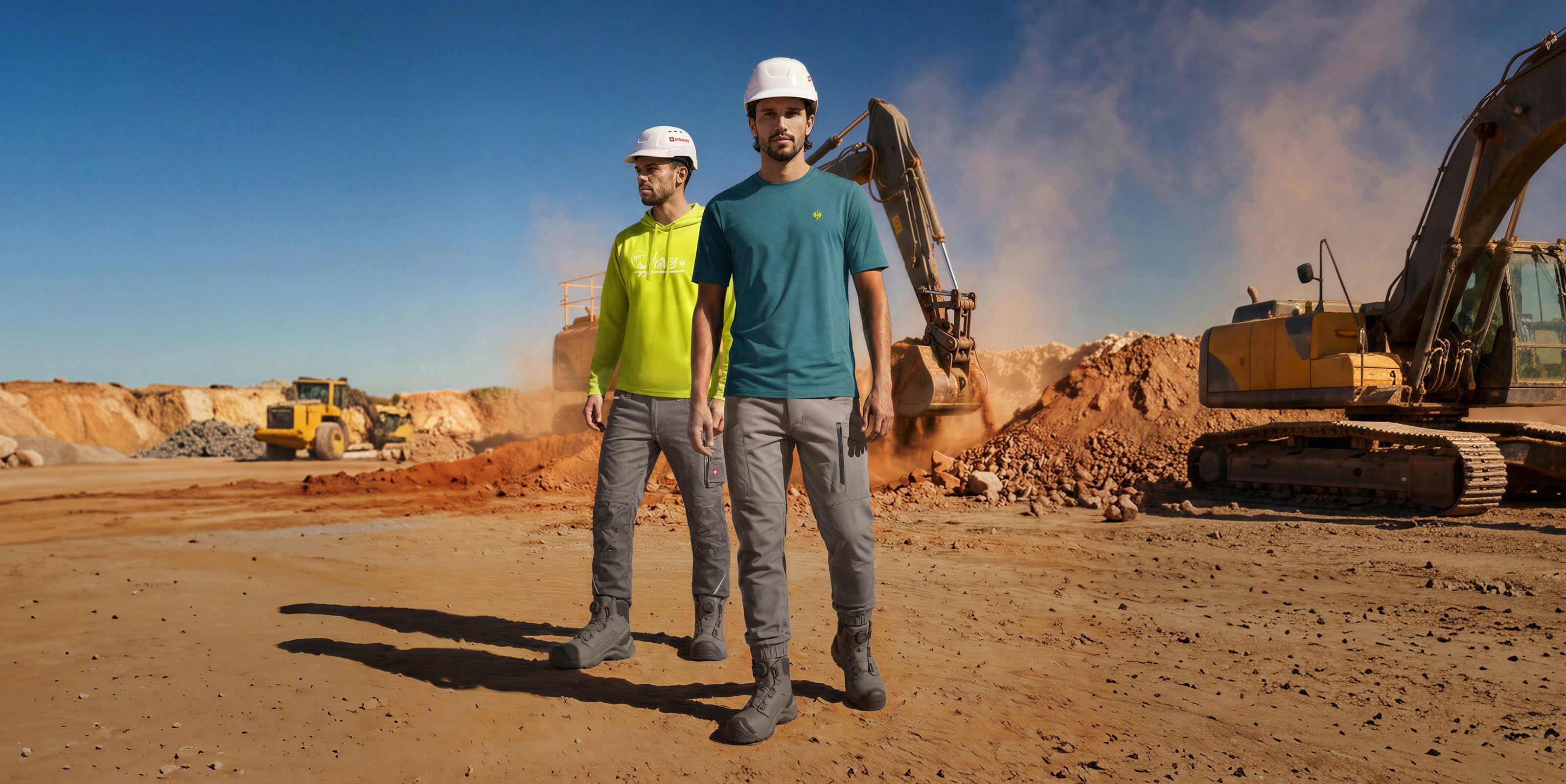 Two men stand in a jobsite wearing strauss workwear